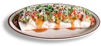 Plate of five beef tacos topped with shredded cheese, diced tomatoes, guacamole, shredded lettuce, and microgreens.