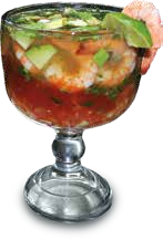 A Michelada in a large glass with a lime wedge and a pink straw