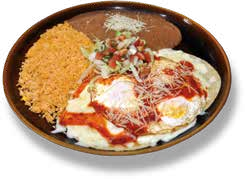 Plate with breaded fried cutlet, fried eggs with tomato sauce, shredded cheese, rice with sauce, and a small portion of salad