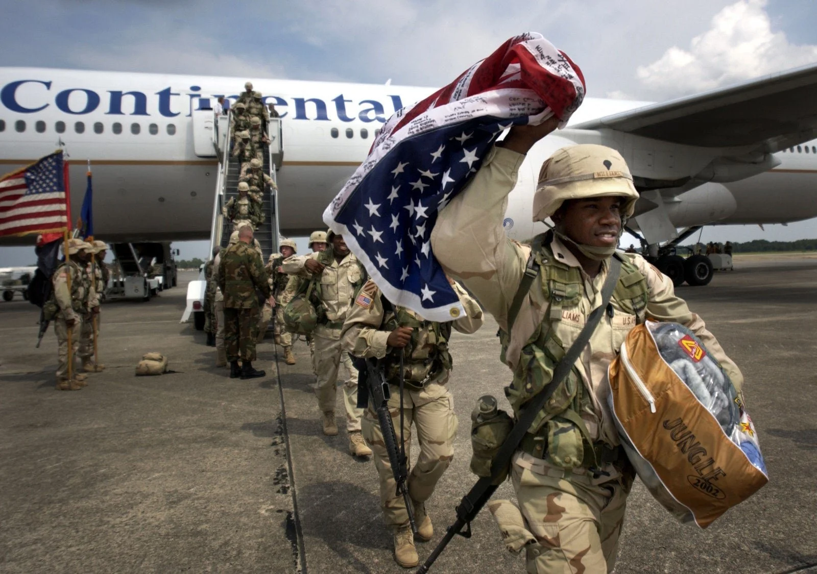 A photo of soldiers returning home, for a YNTK article by John Days.