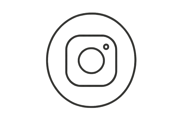 Outline of a camera lens with a smaller circle in the top right corner, representing a lens diagram.