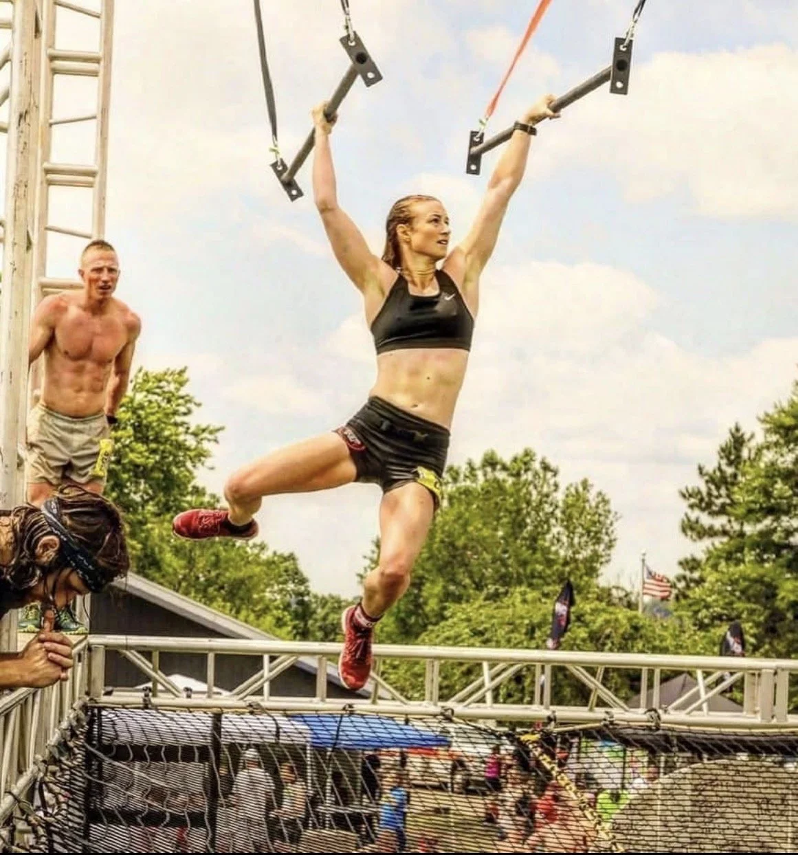 Colorado Spring's OCR Coach Rory Scher of HartFit ELEVATE OCR completes one of many rigs at the Indian Mud Run.