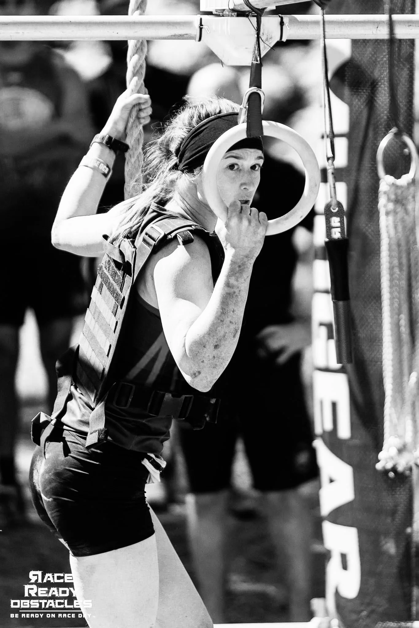 Coach Rory Scher preparing to complete the final rig wearing a 20lb weighted vest in at the 2022 Frontline OCR Special Forces Division