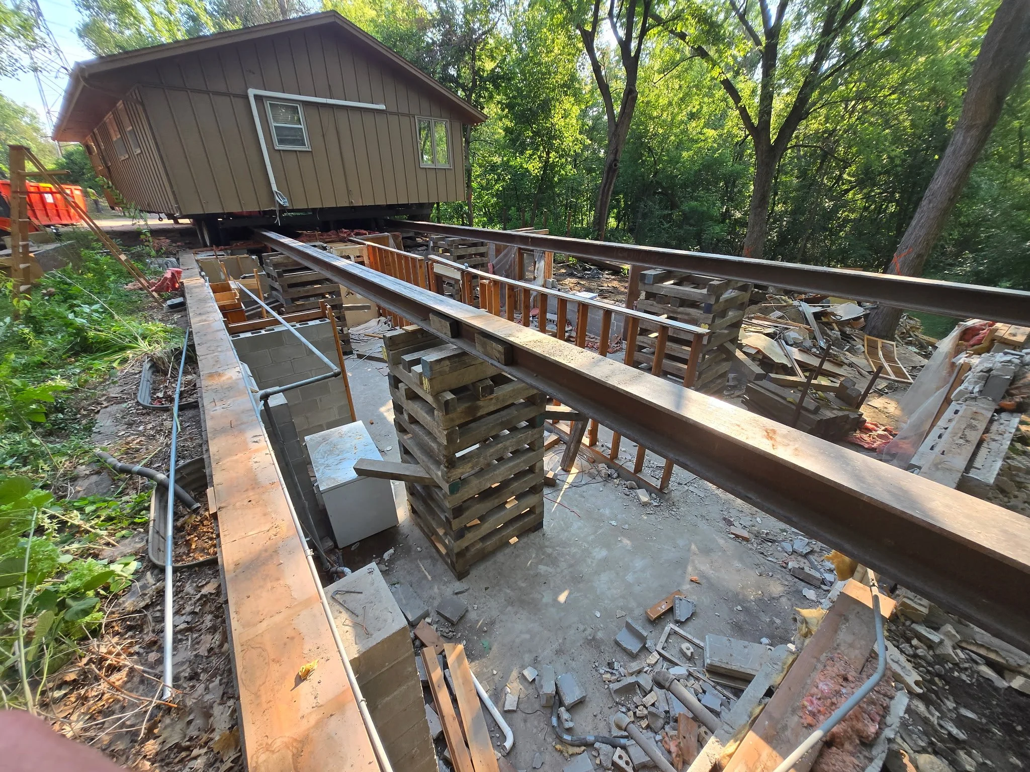 House relocation with existing foundation and moving beams