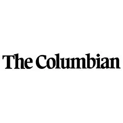 The logo of The Columbian newspaper in black text.