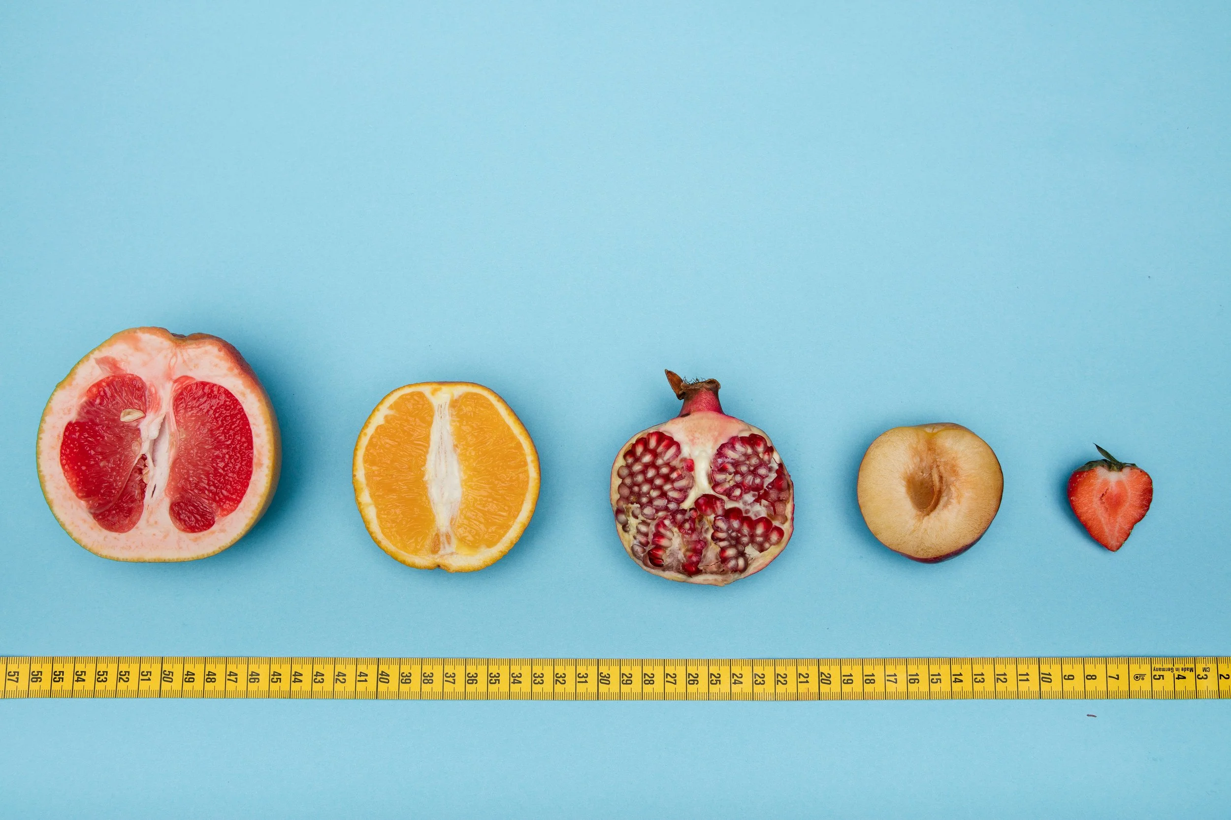picture of fruits with a measuring tape below
