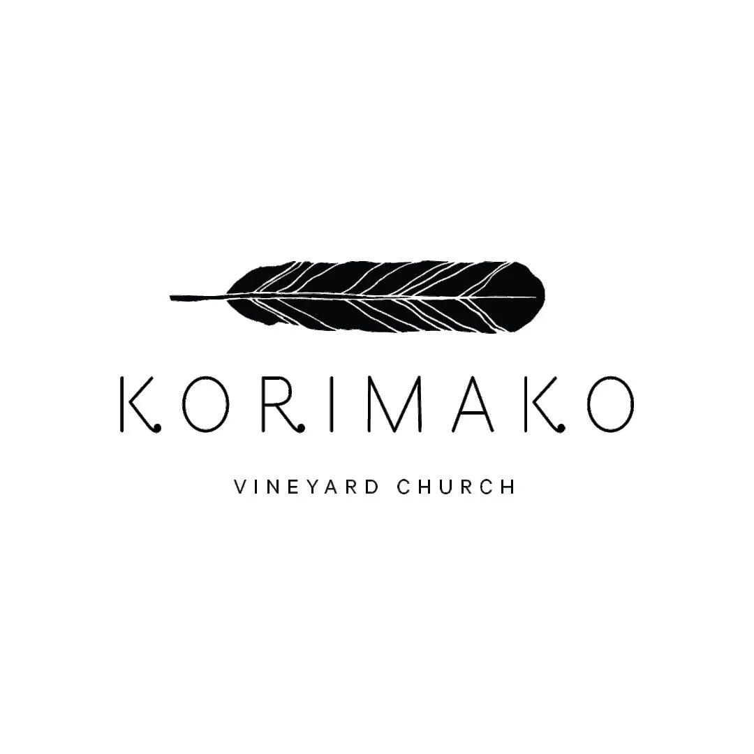 Logo featuring a black feather above the words 'KORIMAKO' and 'VINEYARD CHURCH' on a white background.