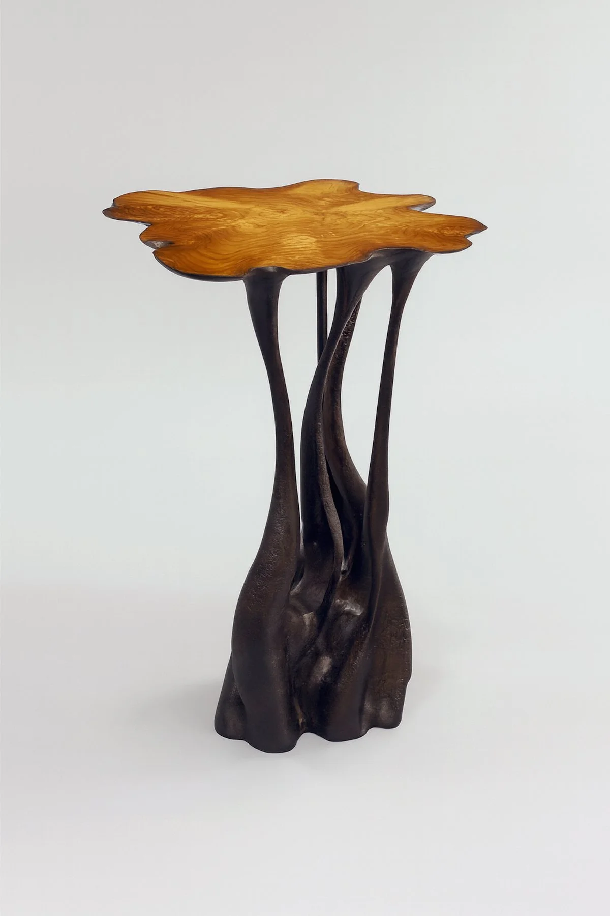 Side table carved from solid tree trunk reclaimed in the local community.