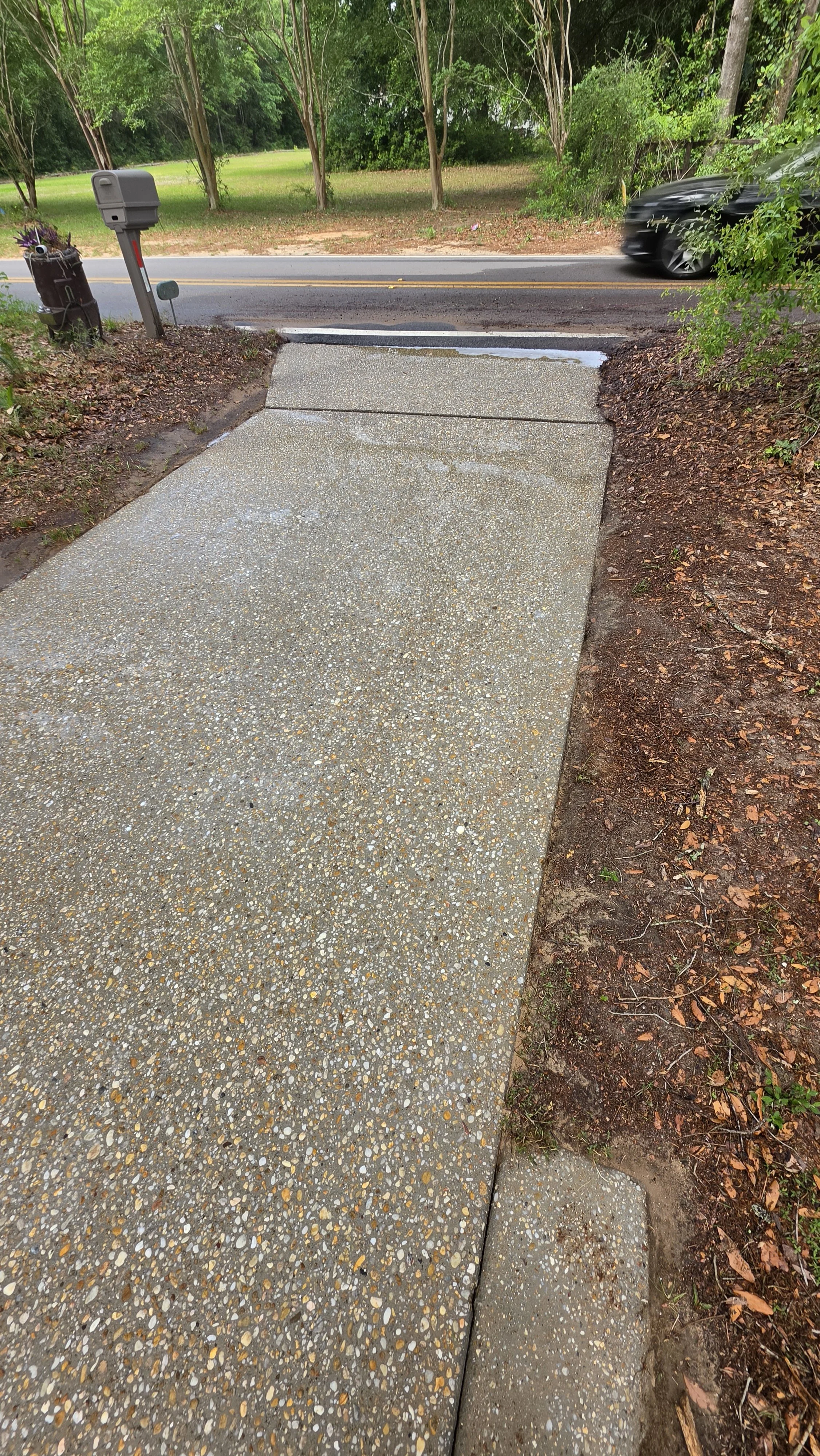 A freshly pressure washed driveway done professionally and efficiently.