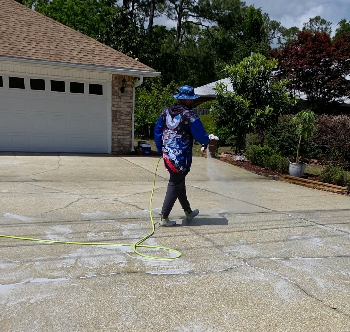 Deep cleaning concrete driveway pressure washing service restoring curb appeal in Pensacola.