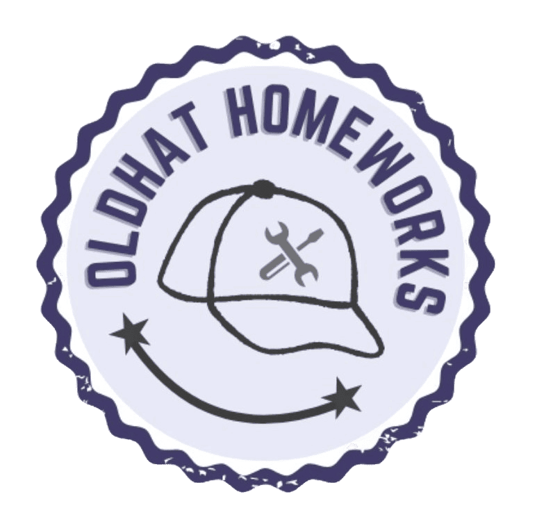 A circular badge with a wavy edge featuring the text "OLD HAT HOMEWORKS" around the top. In the center, there is a simple line drawing of a baseball cap with a wrench and screwdriver crossed inside it. A curved line with two stars extends from the bottom left to the bottom right.