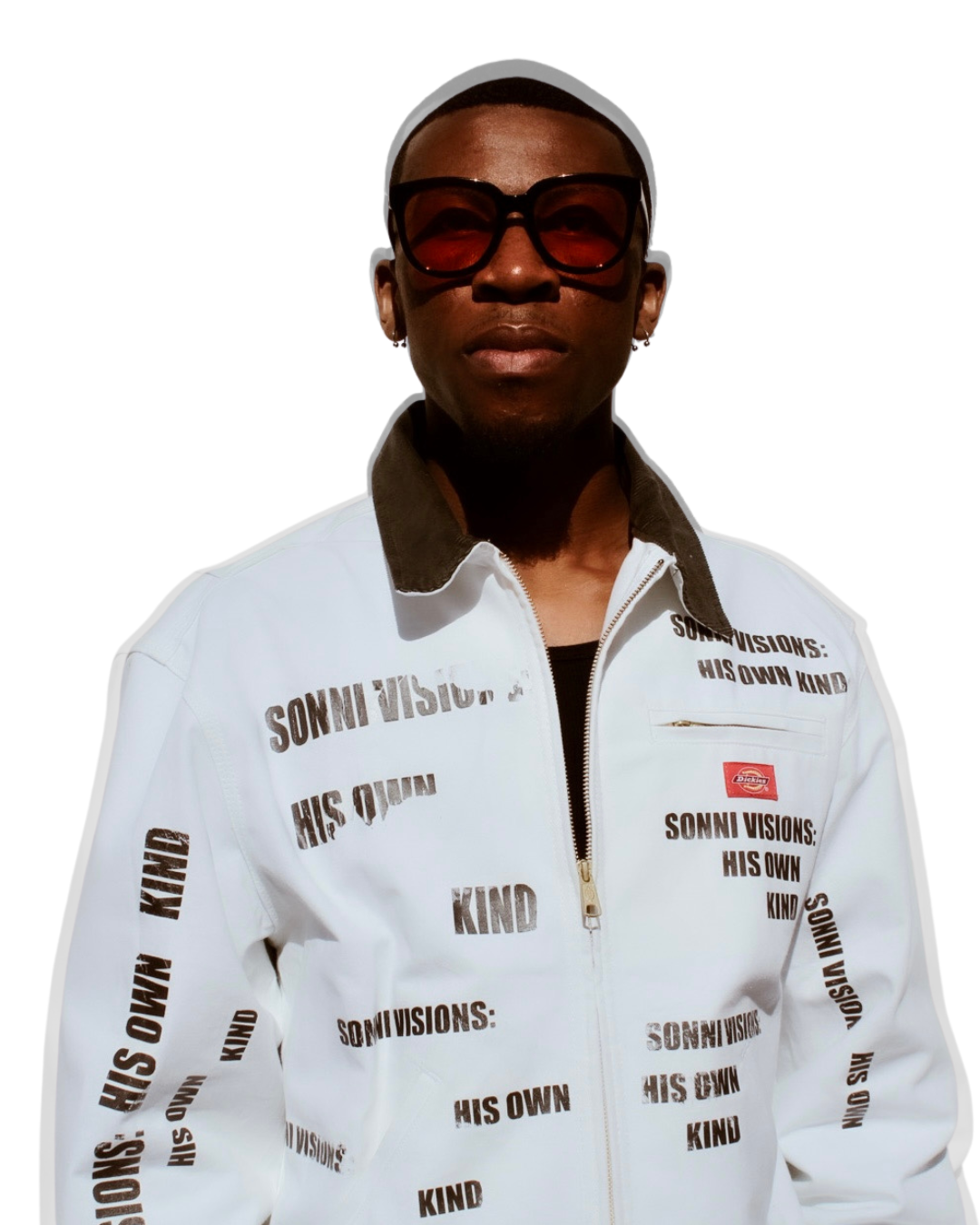 Man wearing large sunglasses, black shirt, and a white jacket with black text that says "SONNI VISIONS: HIS OWN KIND."