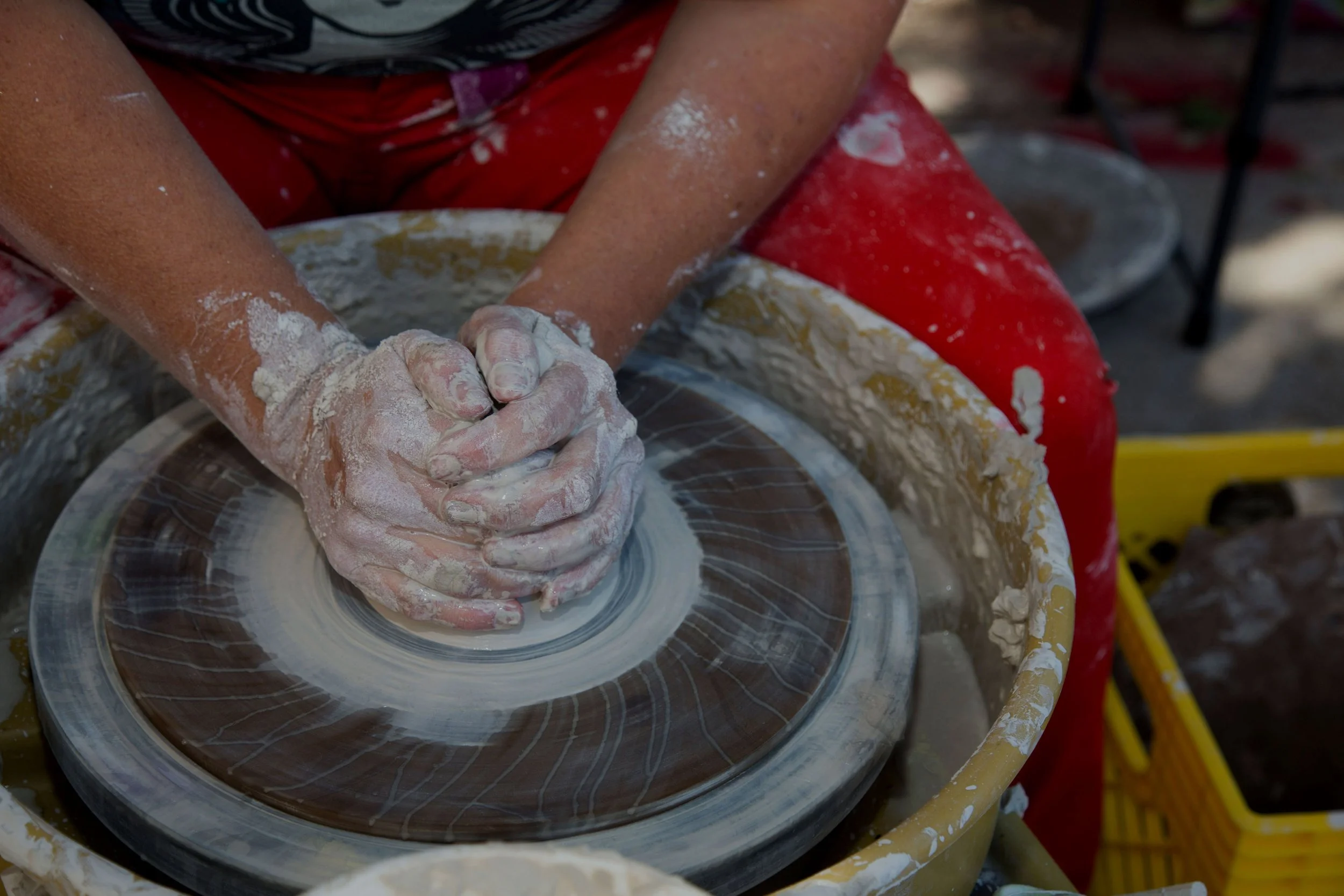 A potter making more bowls for the Austin Empty Bowl event.