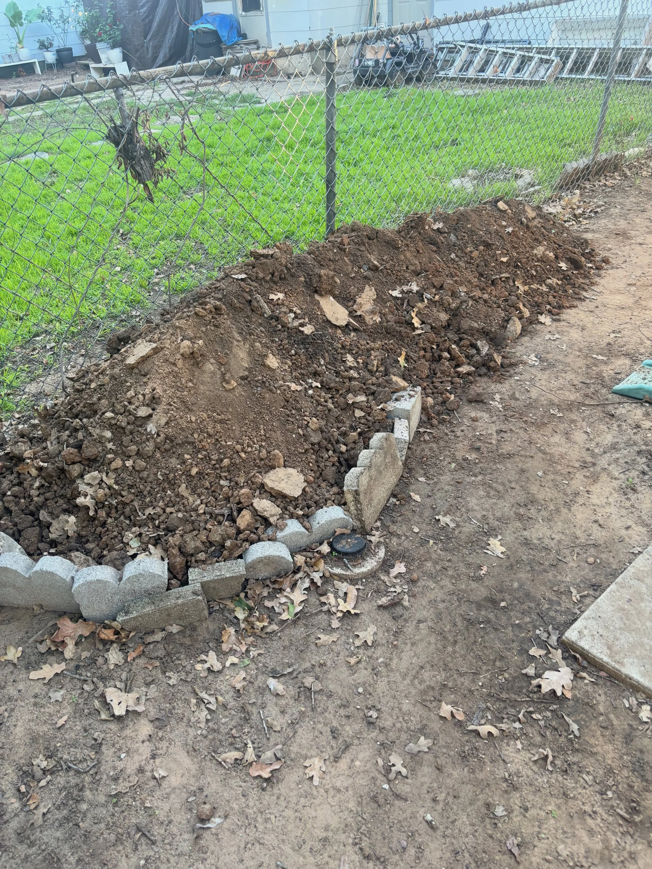 Dirt, broken concrete, and rebar reinforced concrete all loaded up and hauled away! 

This job included removing piles of dirt, old landscape edging, and heavy concrete pieces from the backyard, leaving the customer with a cleaner space and no leftov
