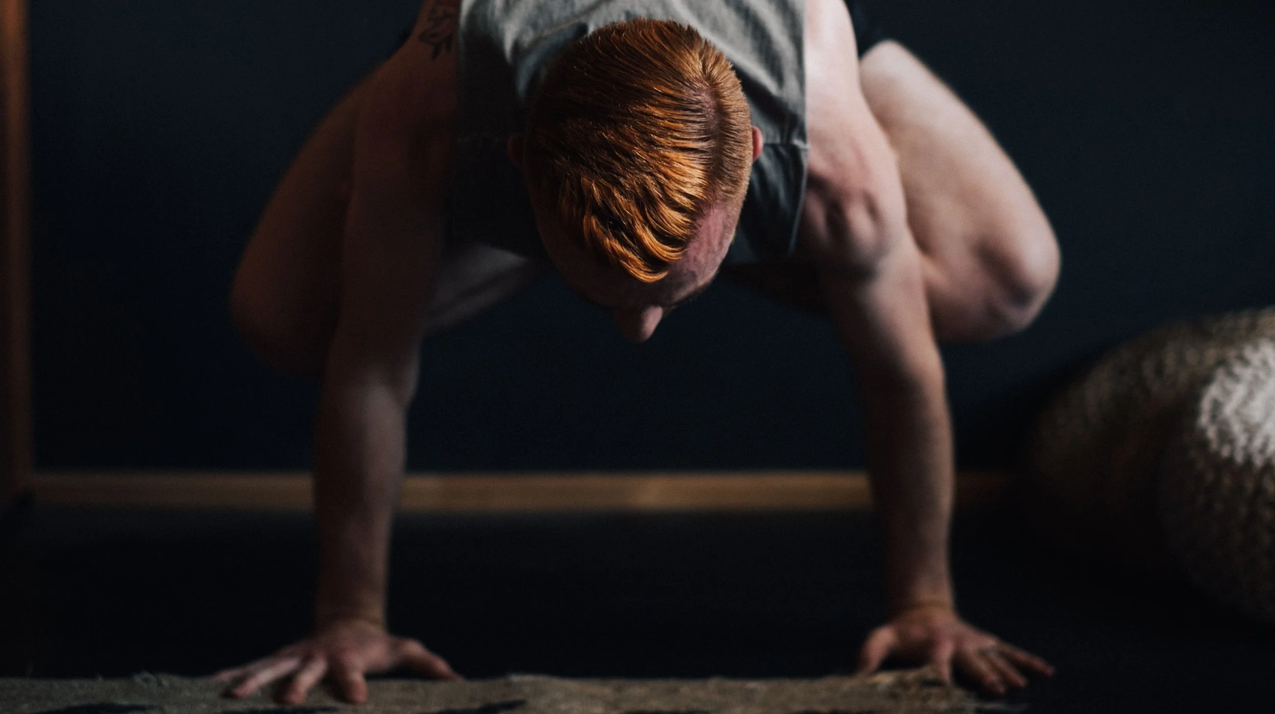 a man balances on his hands