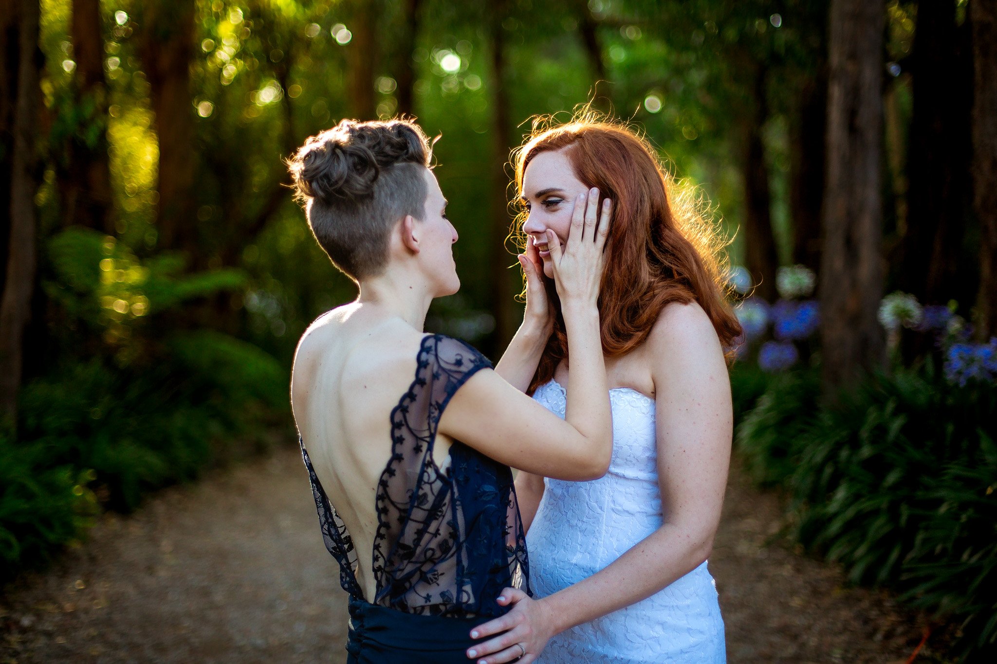 Same-sex wedding couple photographed in a forest setting by Christchurch wedding photographer One Velvet Morning.