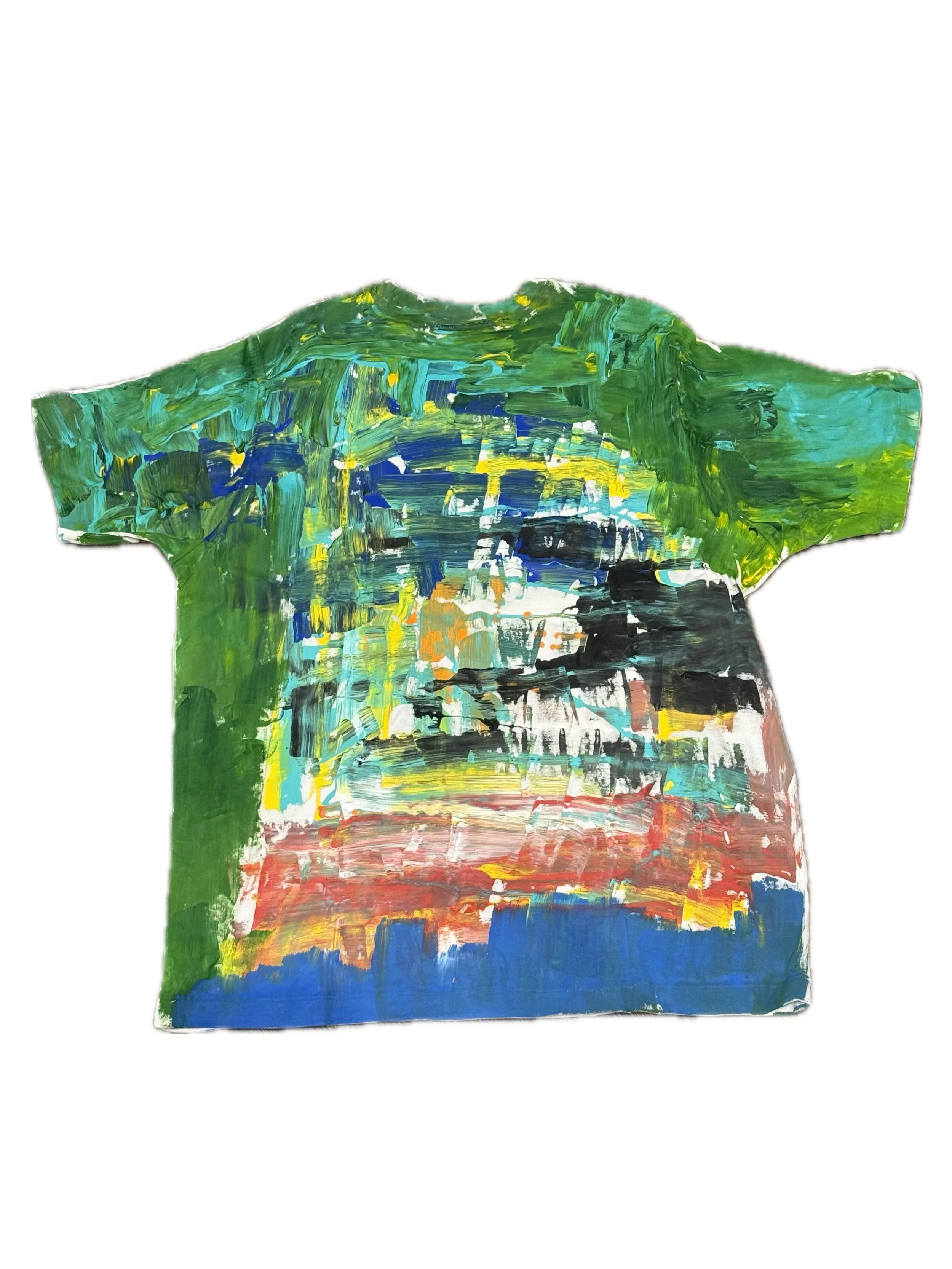 A colorful, abstract painting on a piece of paper that has been shaped into a T-shirt outline, featuring broad, textured brushstrokes in green, blue, yellow, black, red, and white.
