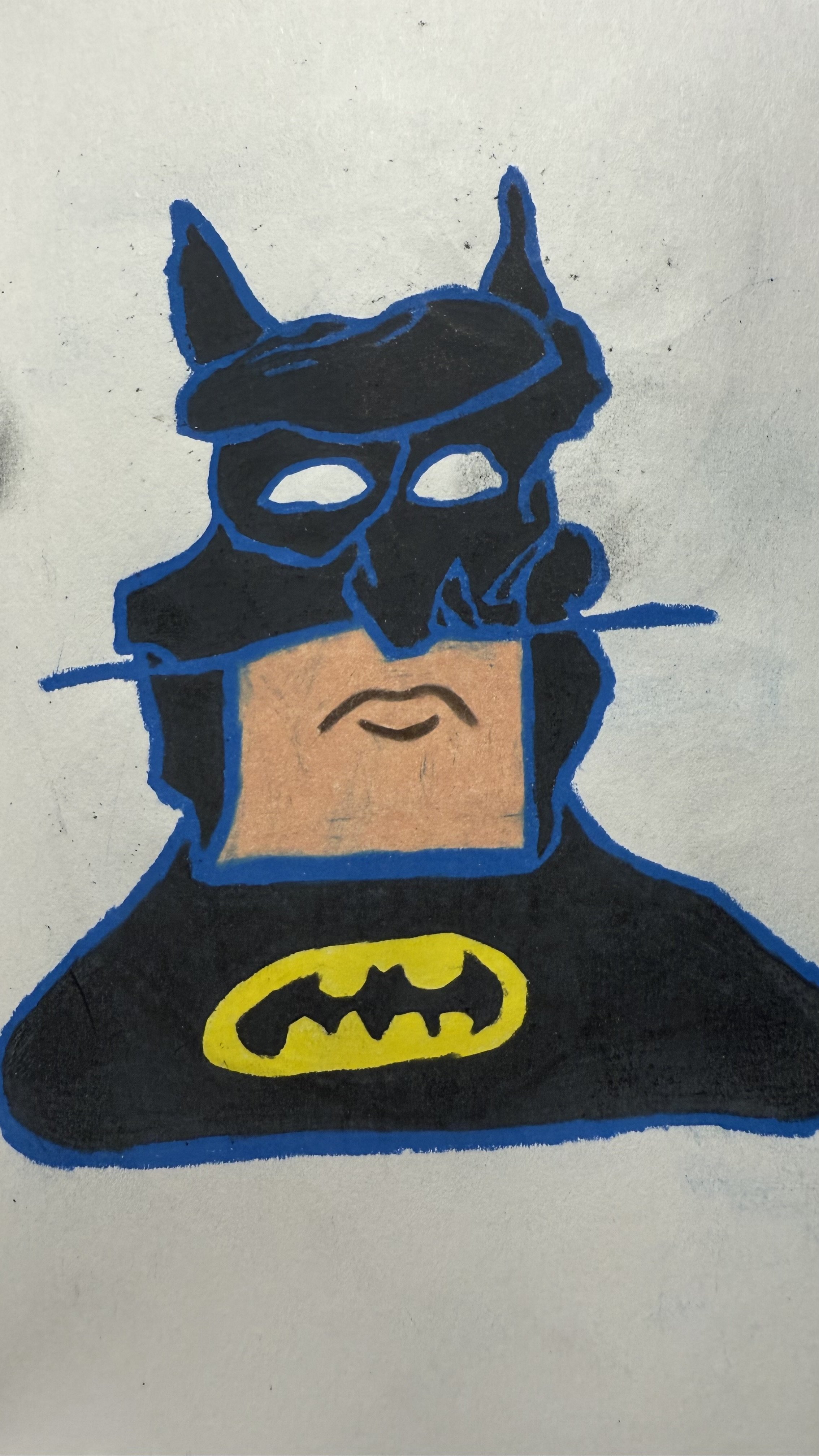 A drawing of Batman with a skull mask floating above his face, wearing his iconic black costume with a yellow bat emblem on the chest.