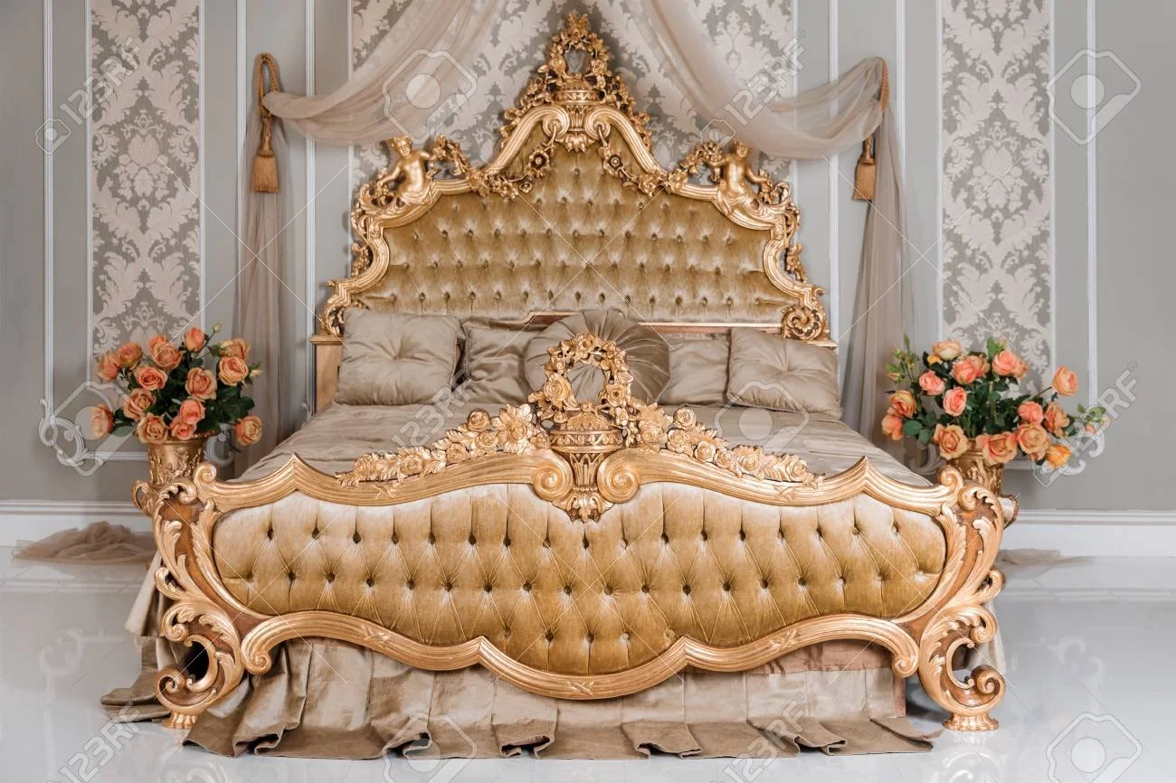 76951407-luxury-bedroom-in-light-colors-with-golden-furniture-details-big-comfortable-double-royal-bed-in.jpg