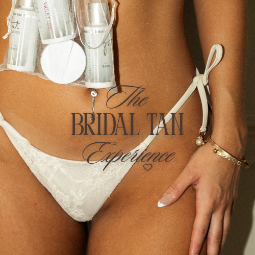 Close-up of a woman's lower abdomen and hand, with a phrase overlay reading "The Bridal Tan Experience" in cursive and bold fonts, and her arm adorned with bracelets.