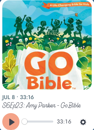 Children and adults dancing and jumping outdoors during daytime with a bright sky, surrounding a large open Bible with the words 'Go Bible' on its pages, decorated with green leaves and flowers. The image promotes a children's Bible app or program.