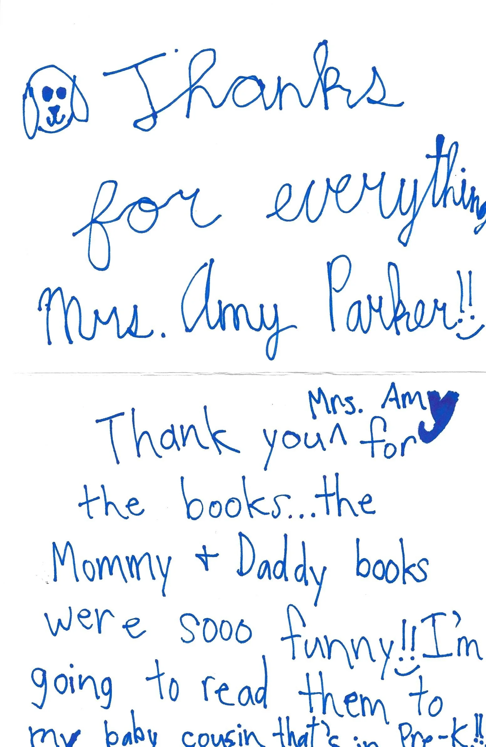 Handwritten note with a drawing of a dog, expressing gratitude for books received from a person named Amy, and mentioning the joy of reading and sharing books with family.