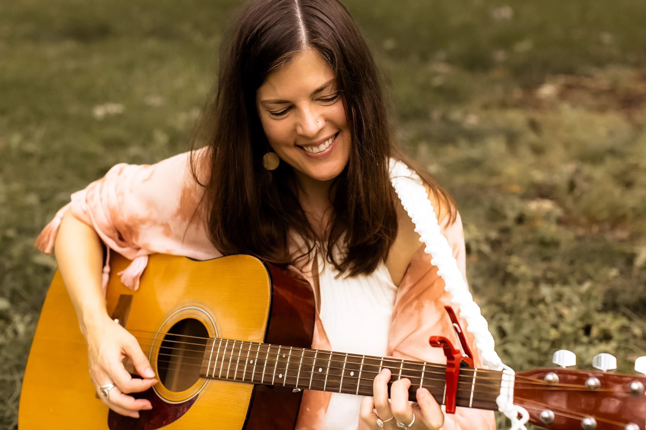 Kristi playing her guitar