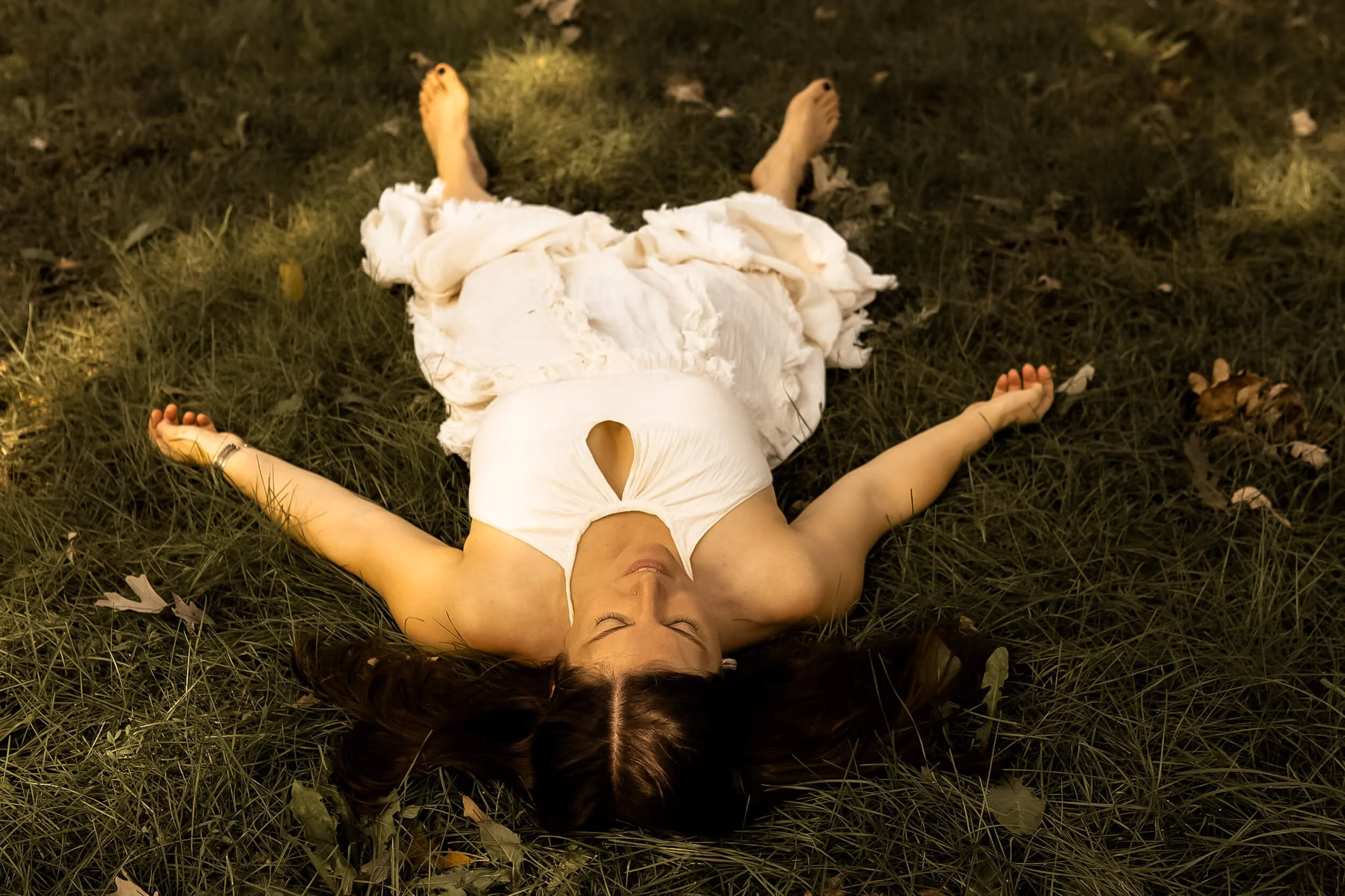 Kristi laying down in the grass