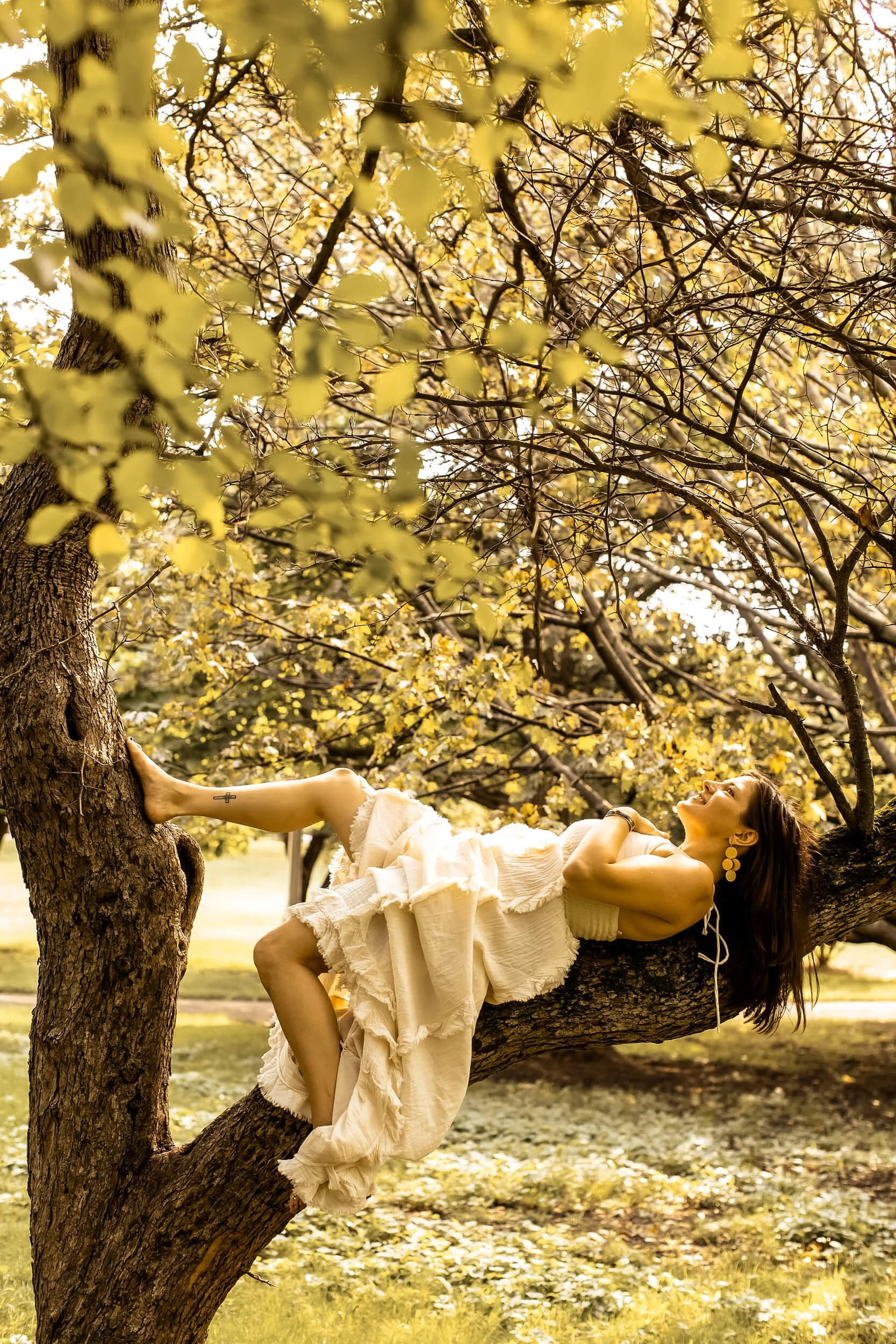 Kristi Amdahl lying down on a branch