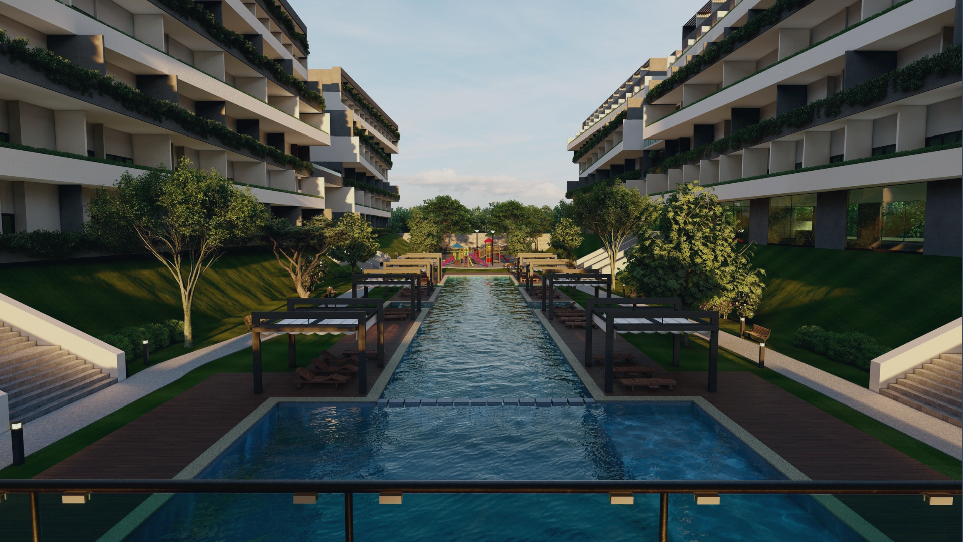 Vista de un complejo de apartamentos modernos con una piscina en el centro, áreas verdes, árboles y zonas de descanso, rodeado de edificios de varios pisos con balcones.