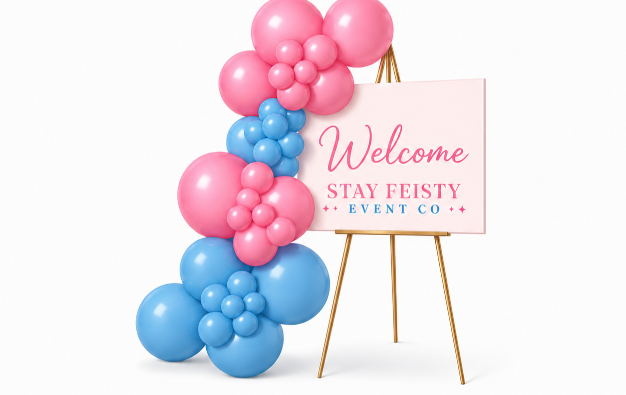 Pink and blue balloon arrangements around a welcome sign on an easel for an event by Stay Feisty Event Co.