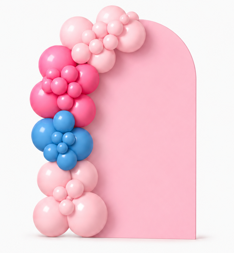 Pink, blue, and purple balloons arranged along the left side of a large, pink, semi-circular backdrop.