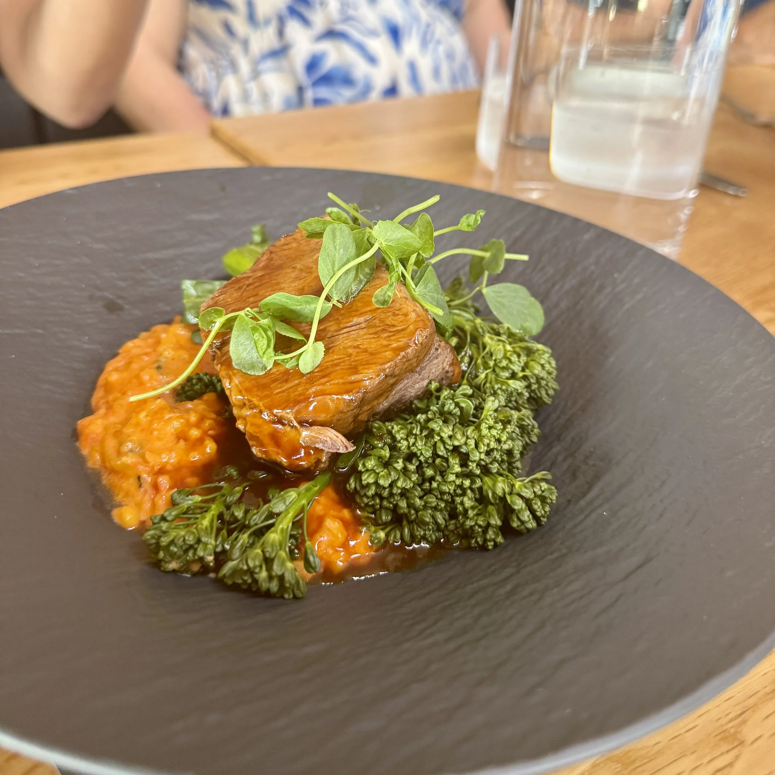 Chef-prepared short rib risotto served on the Taste of Tahoe Tours progressive food tour in South Lake Tahoe, featuring fresh seasonal ingredients and locally inspired cuisine.
