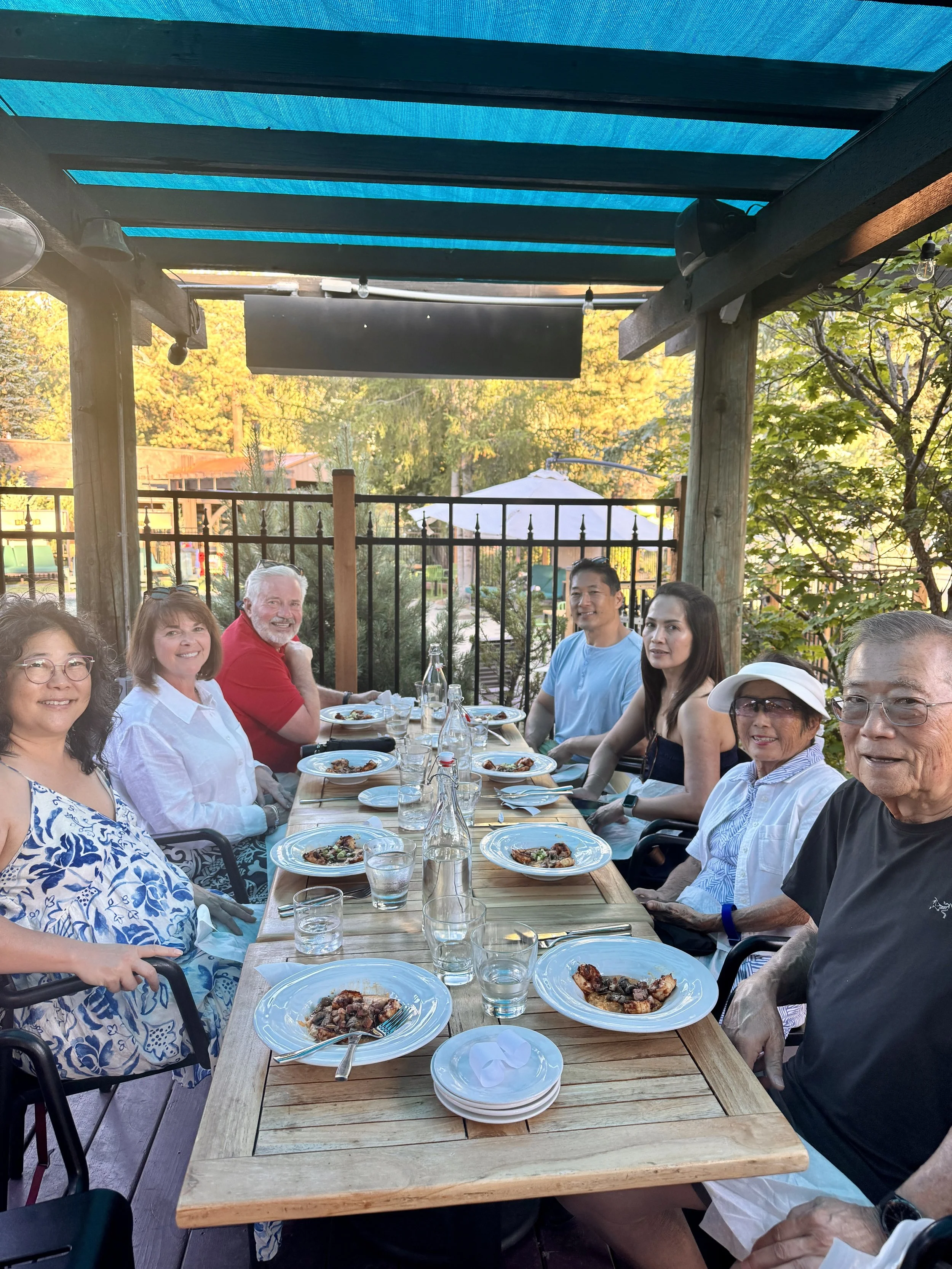 Guests enjoying an outdoor dining experience on a Taste of Tahoe Tours chef-led food tour in South Lake Tahoe, California.