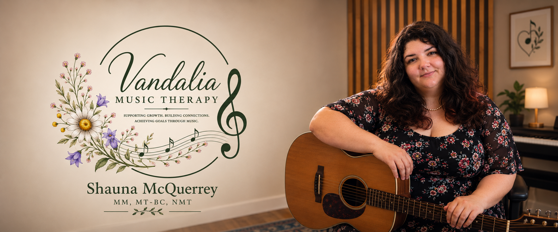 A woman with dark curly hair holding an acoustic guitar, sitting in a music therapy studio with a sign that reads 'Vandalia Music Therapy' and a floral design. The room has a keyboard and a lamp in the background.