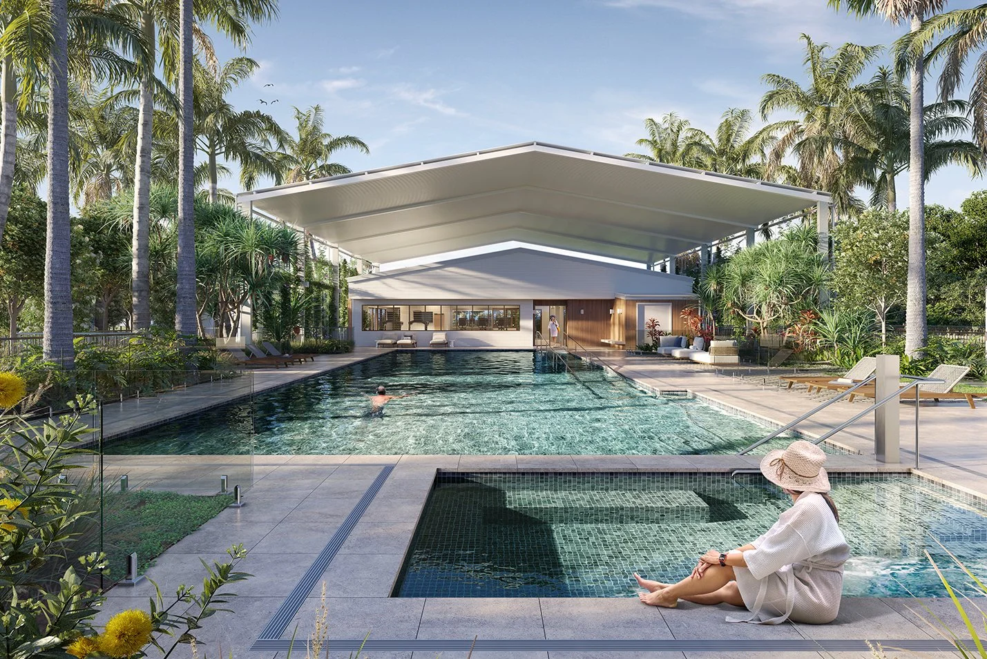Luxurious outdoor pool area with tropical plants, lounge chairs, and a woman sitting by the pool wearing a sun hat and white dress, with a man swimming in the pool. Modern building with large glass windows and a canopy overhead.
