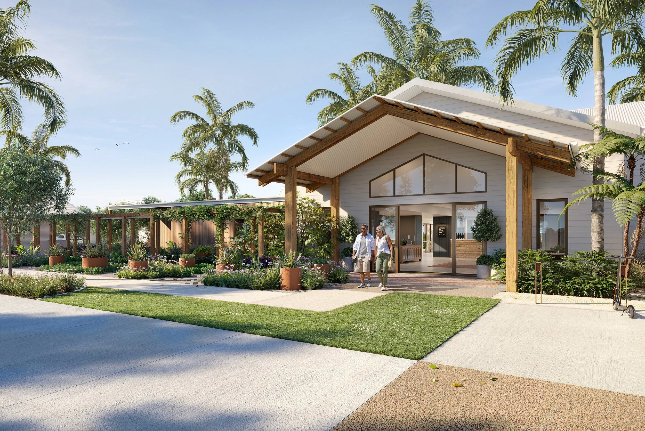 Two women walking out of a modern building surrounded by lush greenery and palm trees, with a clear sky overhead.