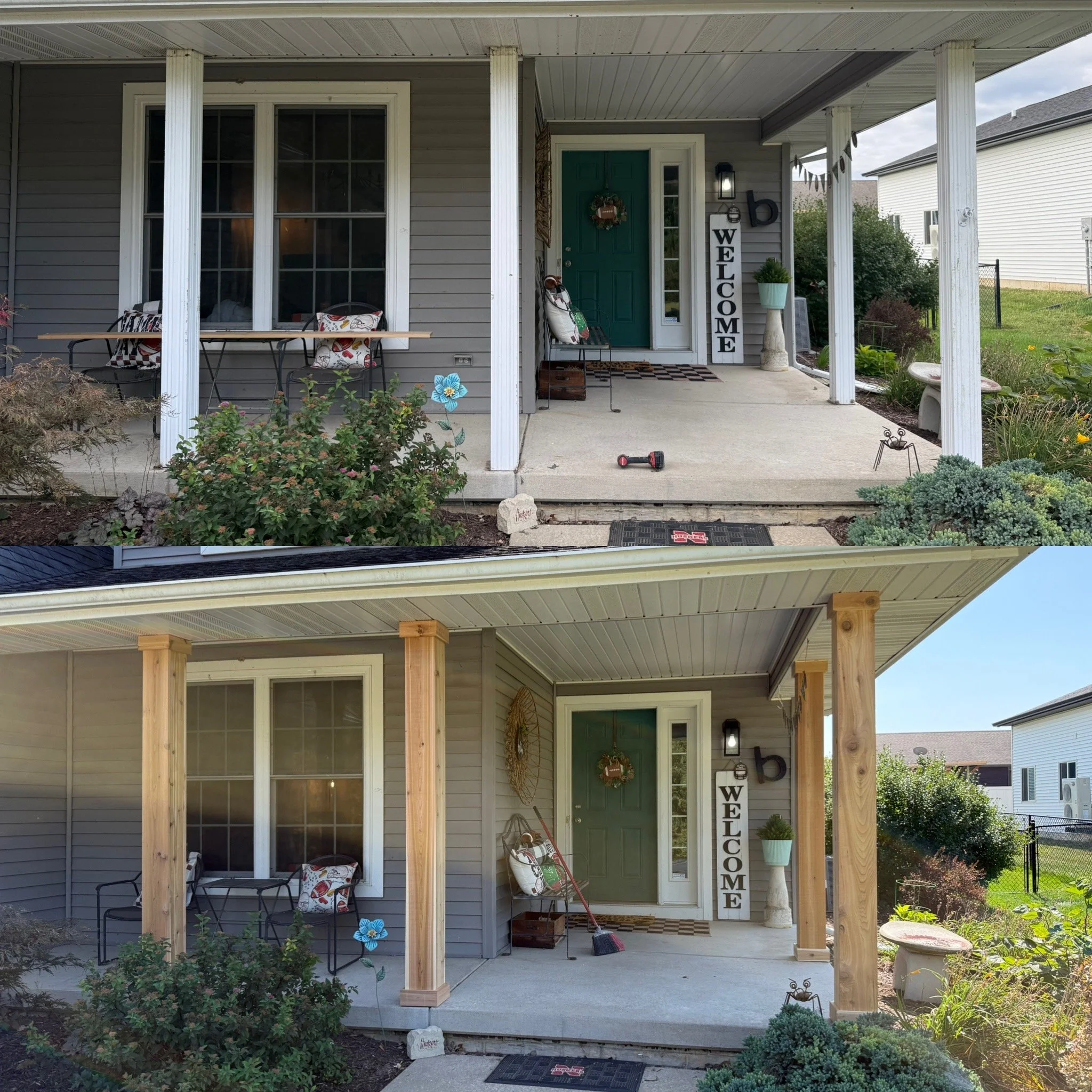 Front porch of a house with a green door, welcome sign, potted plant, and patio furniture, with plants and grass in the yard.