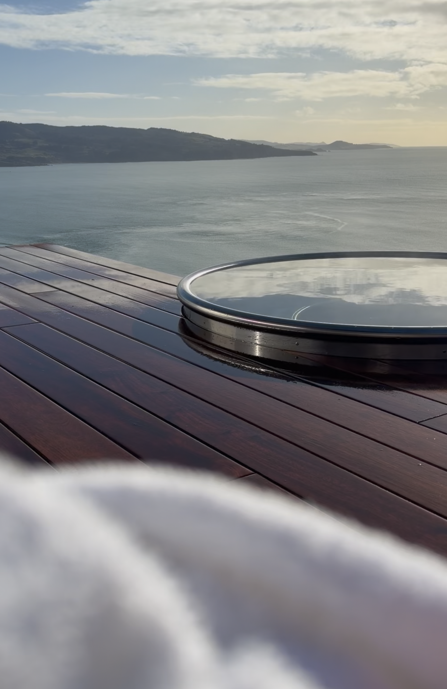 View of an infinity hot tub overlooking the ocean.