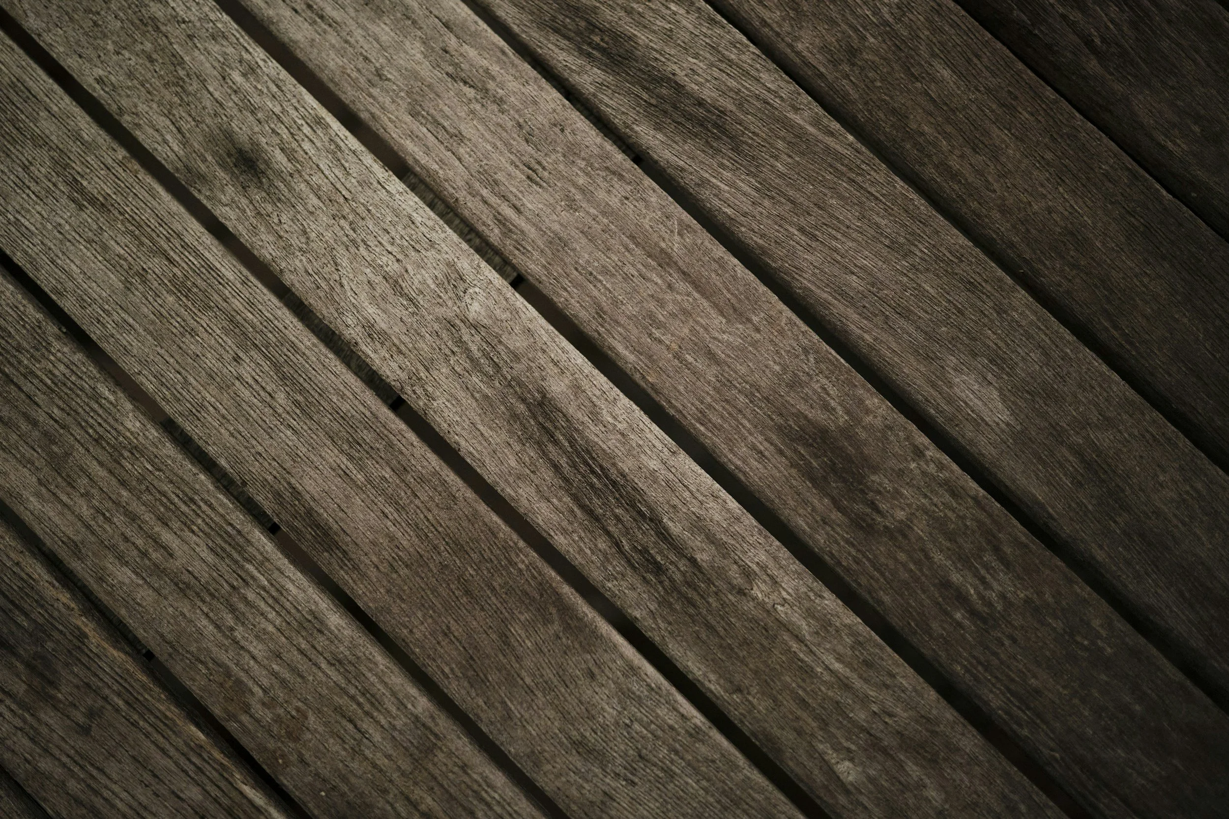 Close-up texture of high-quality wood deck boards installed by a professional deck contractor.
