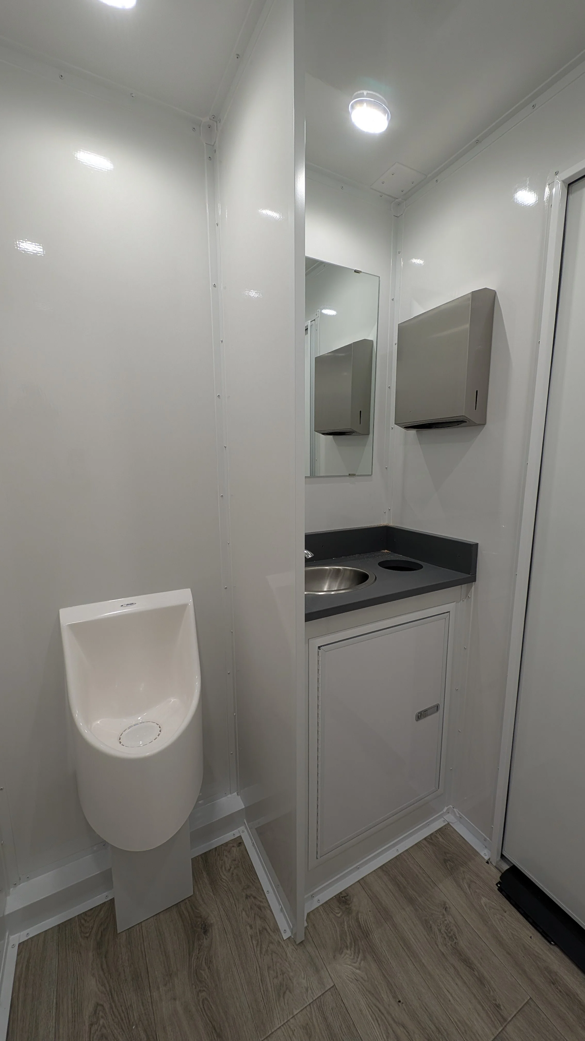 Open urinal with spacious vanity