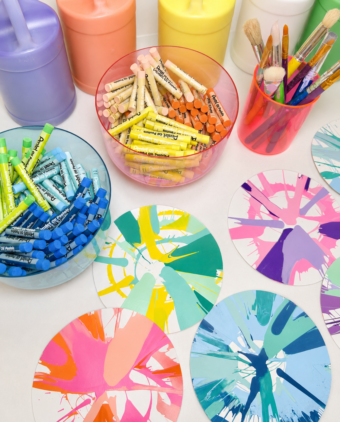 Colorful paint palette on a wooden table at Art House camp