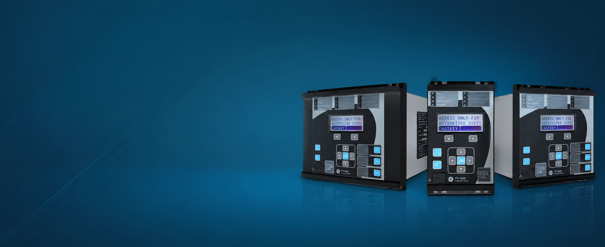 Three black and gray automation controllers with digital screens and buttons, placed on a reflective blue surface against a blue background.