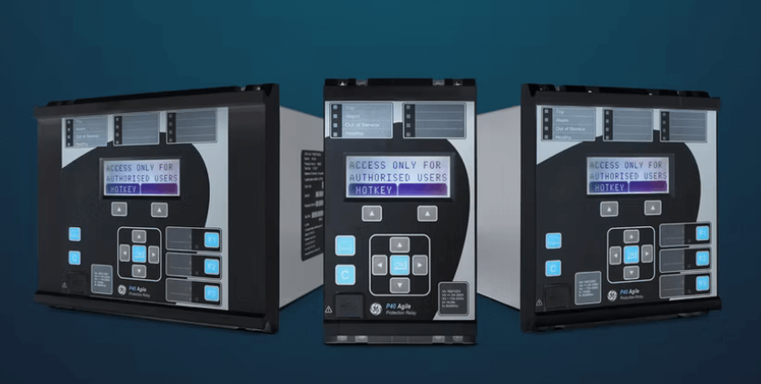 Three industrial control modules with digital displays and various buttons, mounted against a dark background.