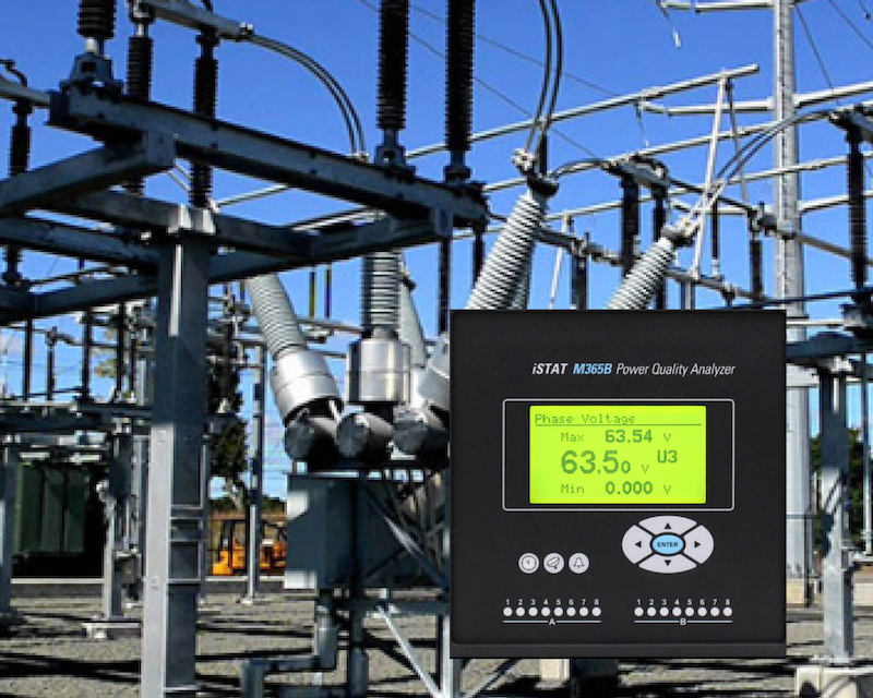 Electrical substation with power lines and a digital voltage analyzer display