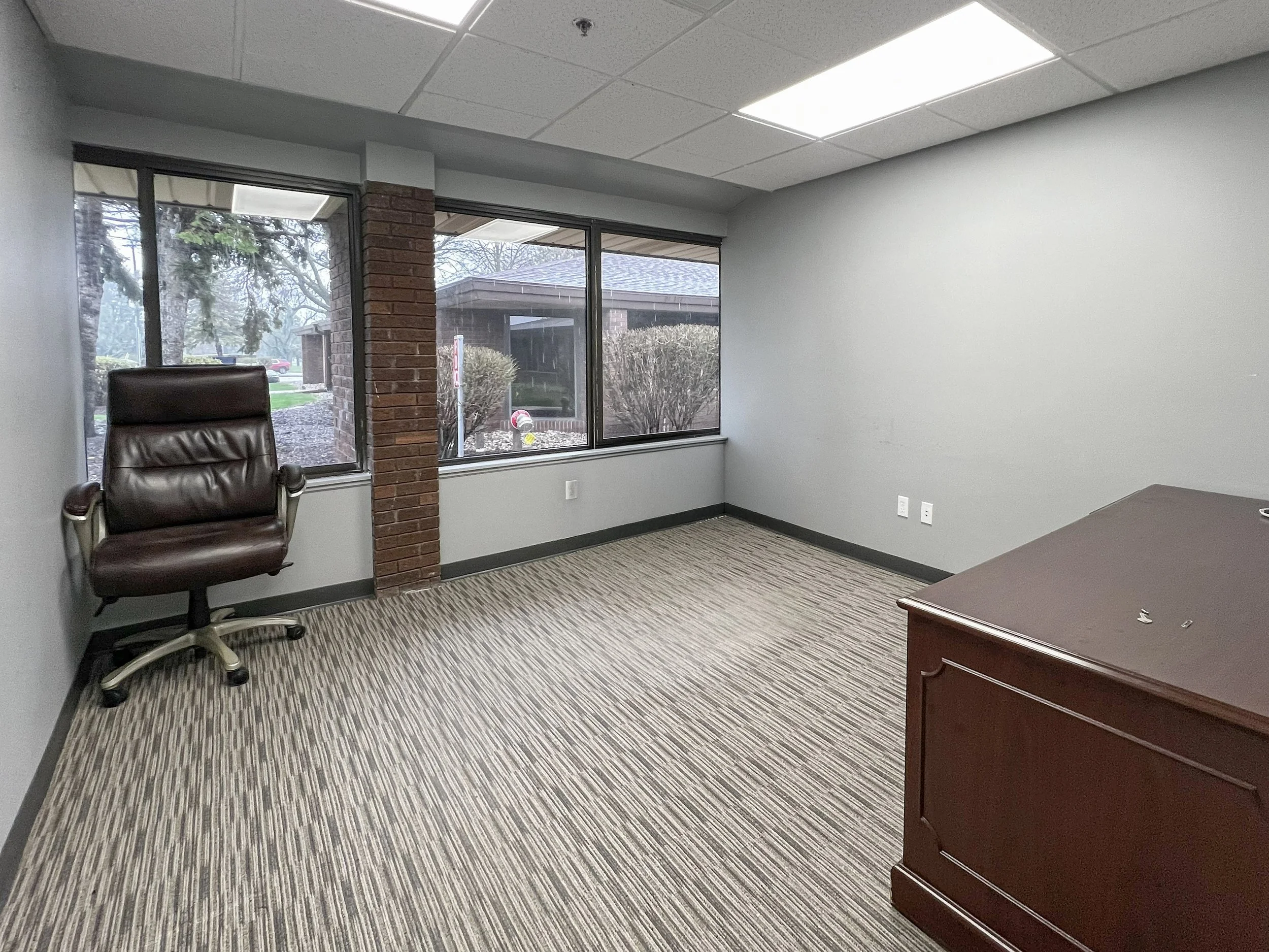 Modern office interior located within a commercial office building at 751-771 Kenmoor Avenue SE in Grand Rapids, Michigan. Office suites available for lease in a convenient business corridor.