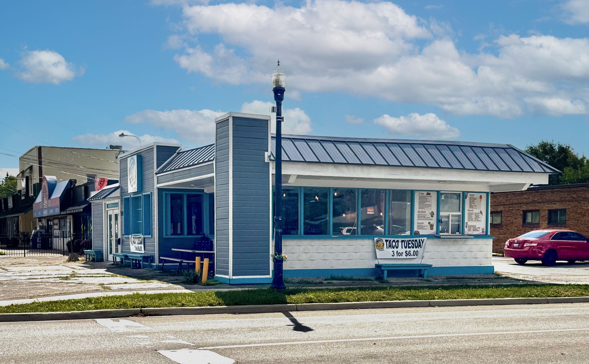 Side view of a commercial building available for sale in the Alger Heights business district of Grand Rapids, Michigan. Excellent opportunity for owner-users or commercial investors.
