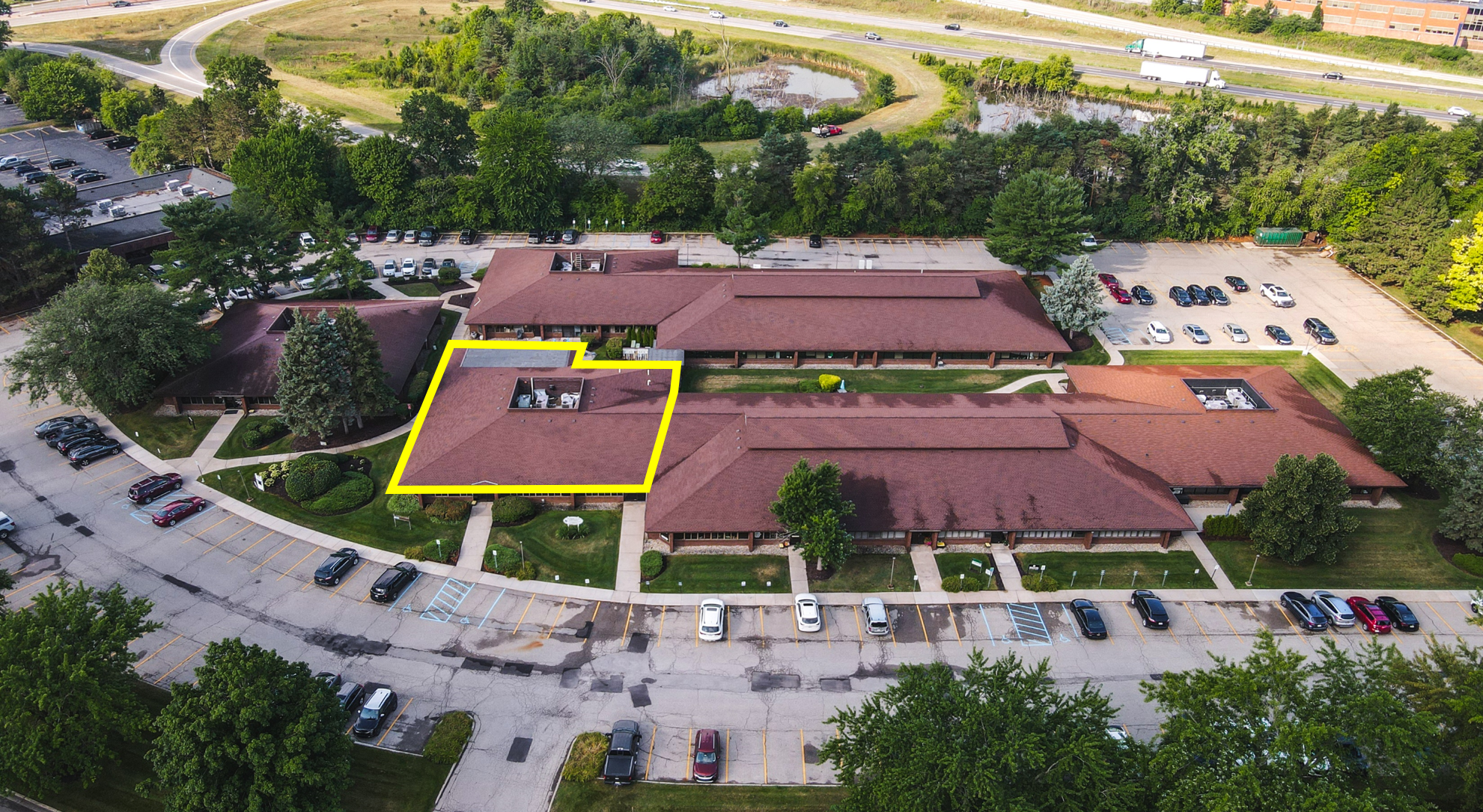 Aerial view of a commercial office building with office suites available for lease at 751-771 Kenmoor Avenue SE in Grand Rapids, Michigan. Conveniently located office space serving businesses throughout West Michigan.