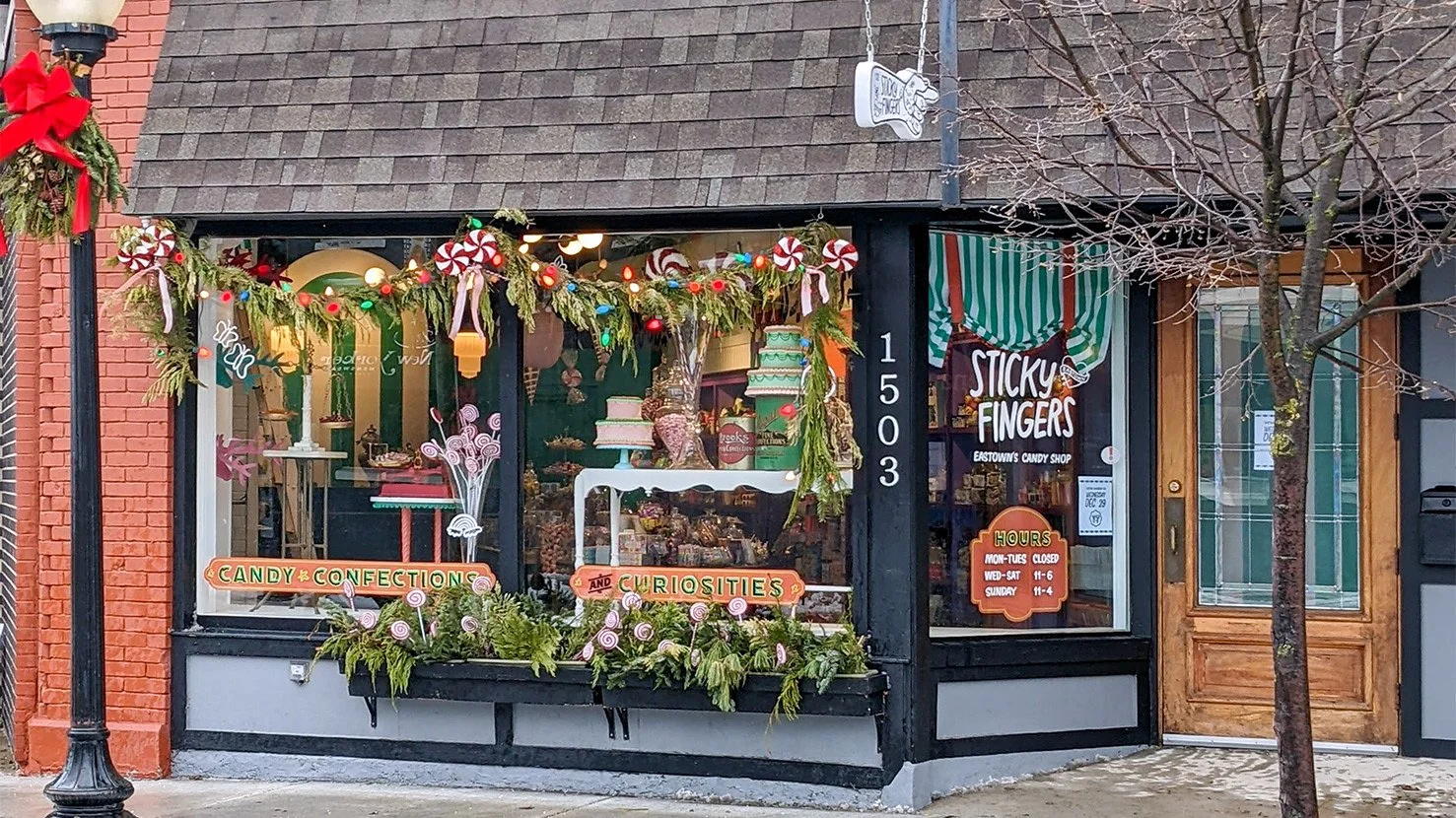 Sticky Fingers storefront located at 1503 Lake Drive SE in Grand Rapids, Michigan. Commercial real estate transaction successfully represented by Erin Peterson in East Grand Rapids' vibrant business district.