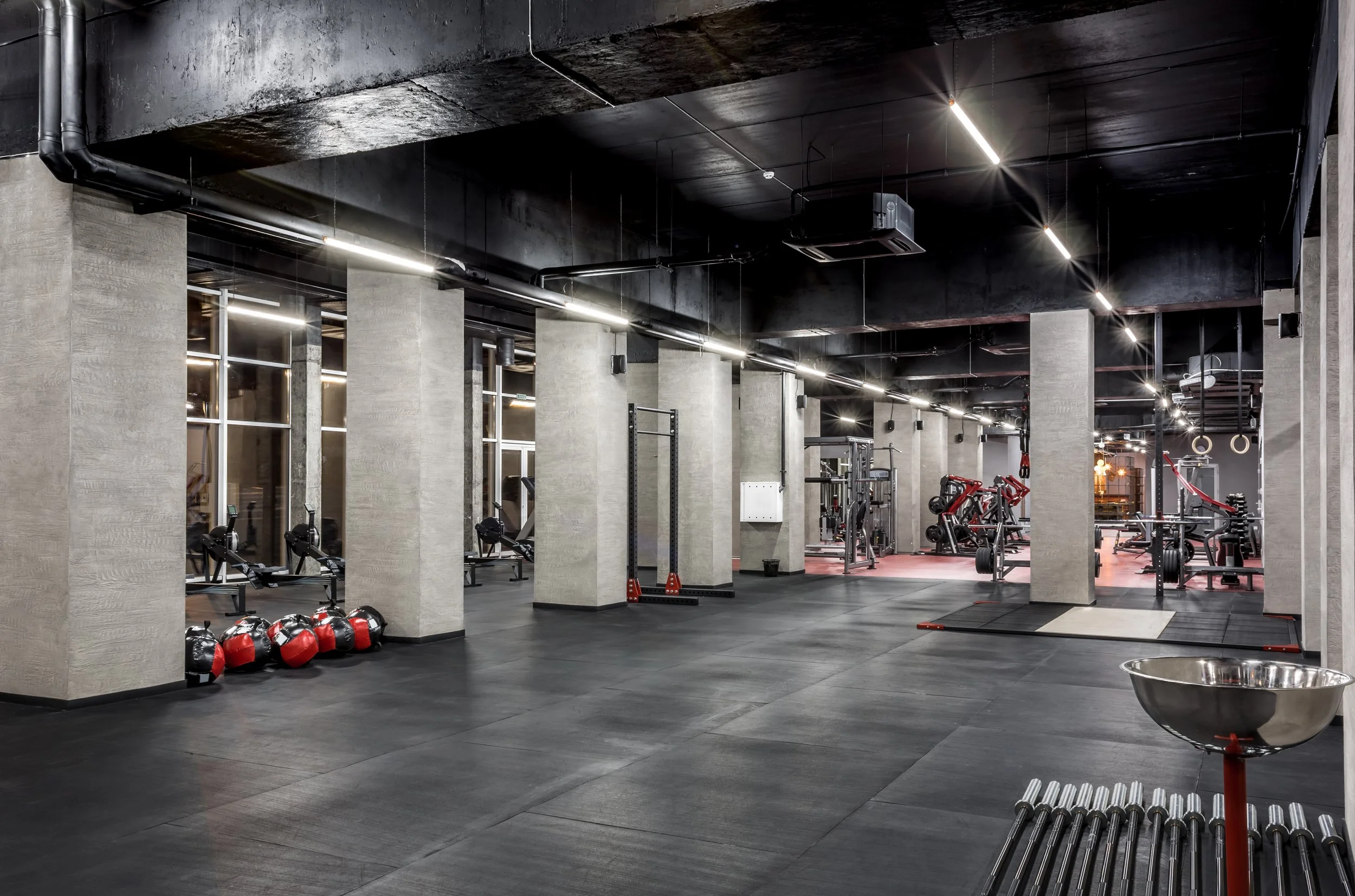 exercise_machines_physical_training_spacious_well_lit_empty_gym.jpg